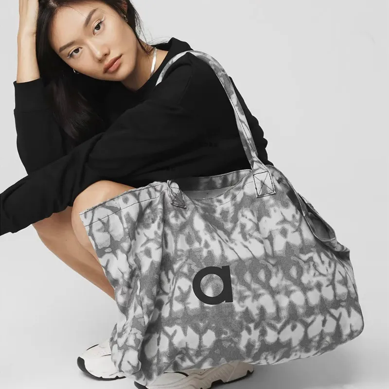 Adesigner Bag Men and Women Fiess Handheld Yoga Gran capacidad Bolsa de viaje a corto plazo Bolsas de lienzo