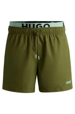 Bañador tipo shorts con logo estampado y cintura doble