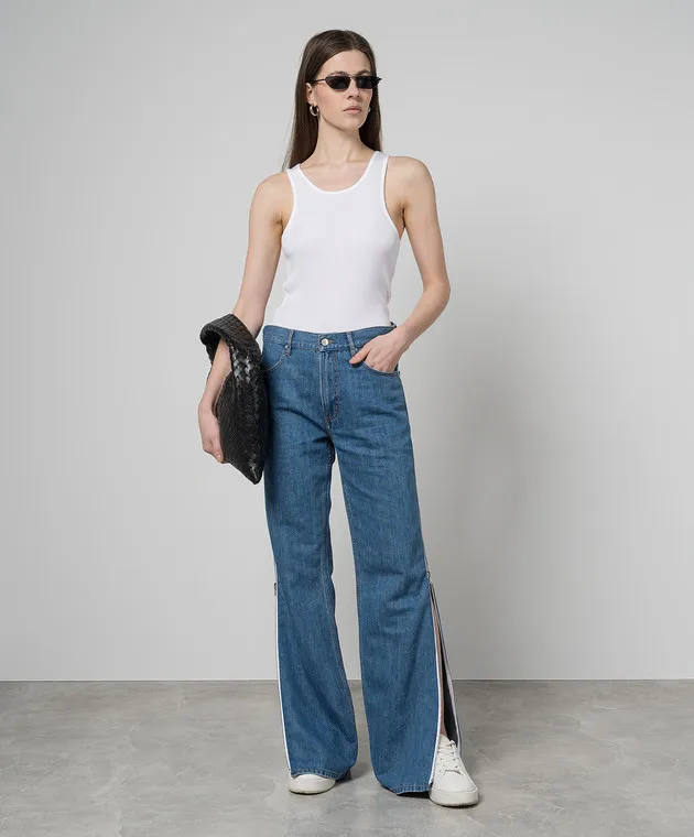 Gauchere White top with a scar