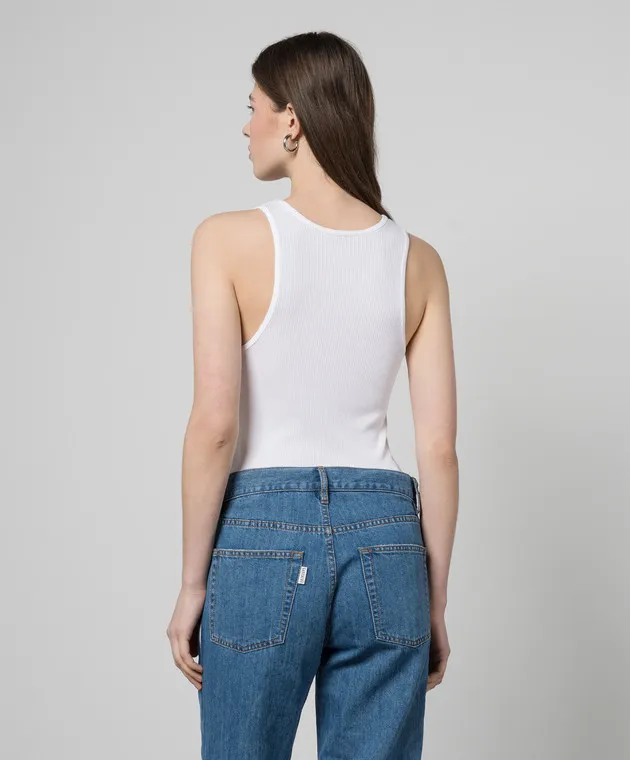 Gauchere White top with a scar